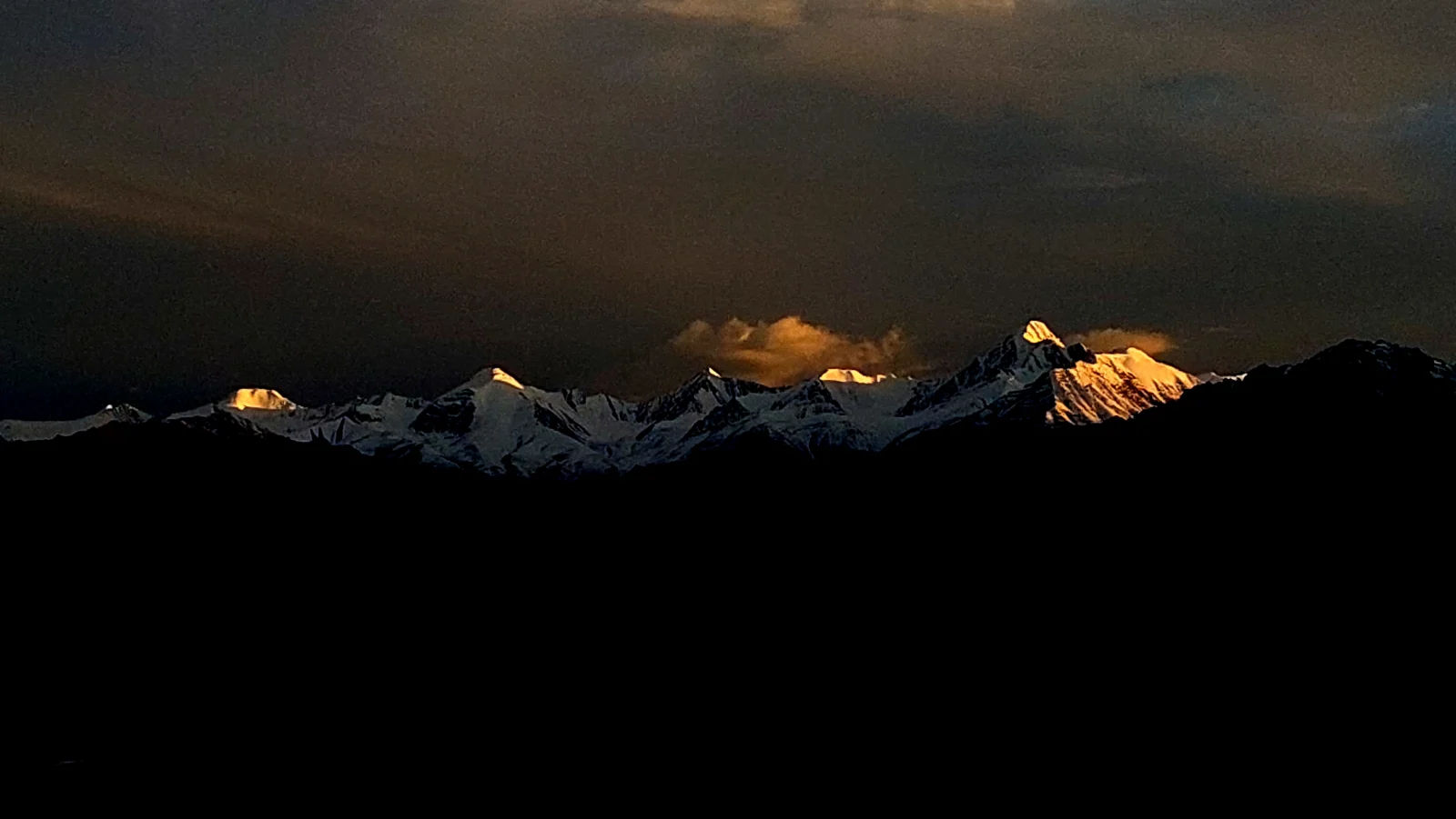 Golden evening light on snowy Himalayan peaks